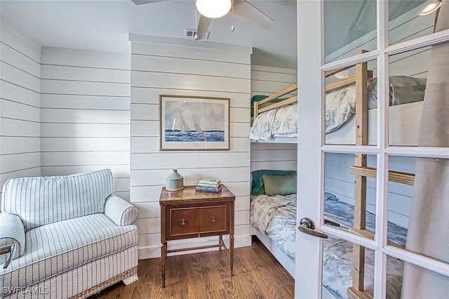 bedroom with ceiling fan and dark hardwood / wood-style floors