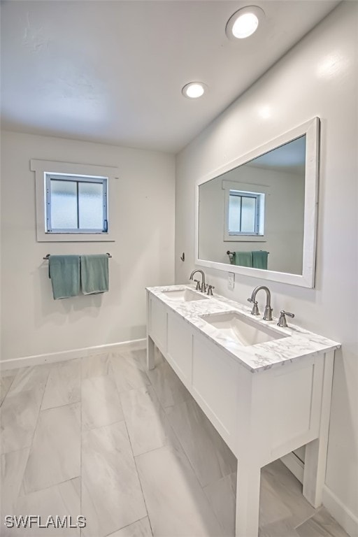 bathroom with vanity and a healthy amount of sunlight