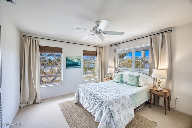 bedroom featuring ceiling fan and light colored carpet