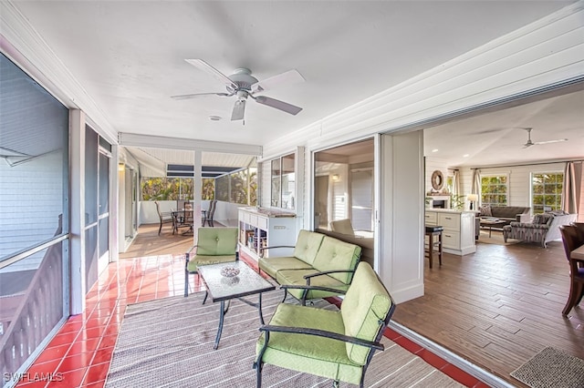 sunroom / solarium with ceiling fan