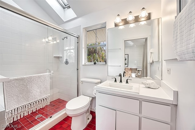 bathroom with a shower with shower door, toilet, lofted ceiling with skylight, and vanity