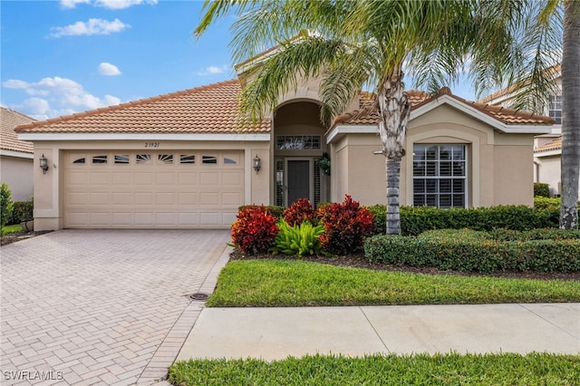 mediterranean / spanish-style home featuring a garage