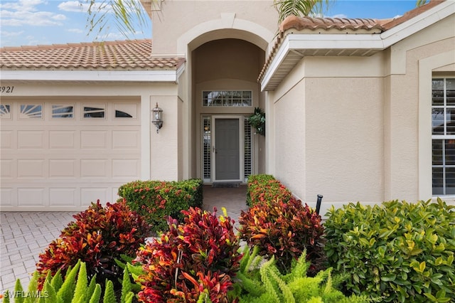 entrance to property featuring a garage