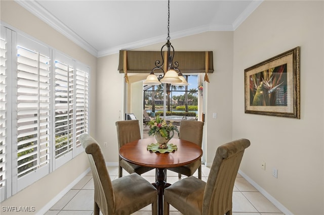 dining space featuring ornamental molding, plenty of natural light, vaulted ceiling, and light tile patterned floors