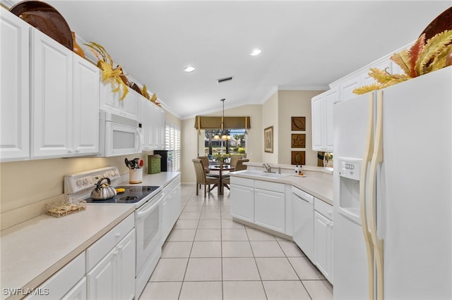 kitchen featuring decorative light fixtures, white cabinetry, lofted ceiling, sink, and white appliances