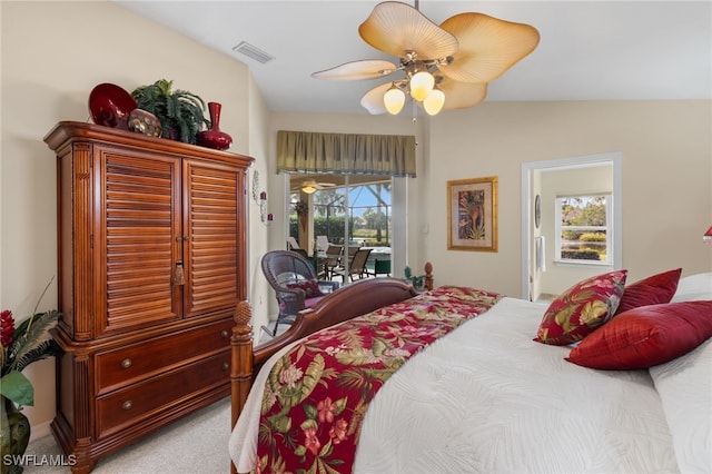 carpeted bedroom featuring access to exterior and ceiling fan