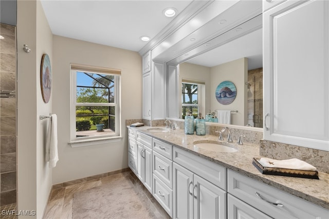 bathroom with vanity and a shower with shower door