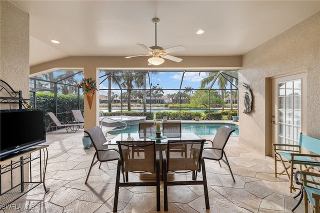 sunroom with vaulted ceiling and ceiling fan