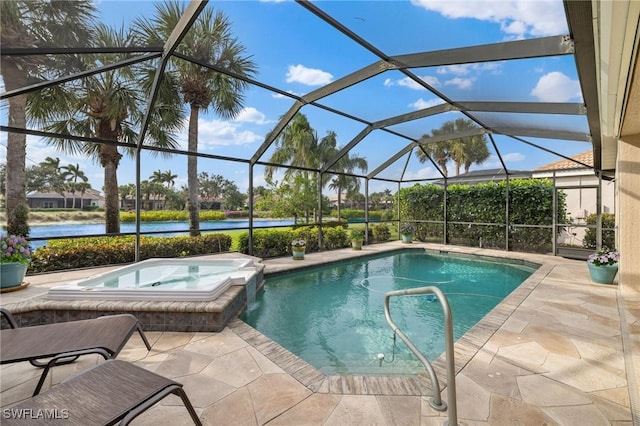 view of swimming pool featuring an in ground hot tub, a water view, glass enclosure, and a patio area