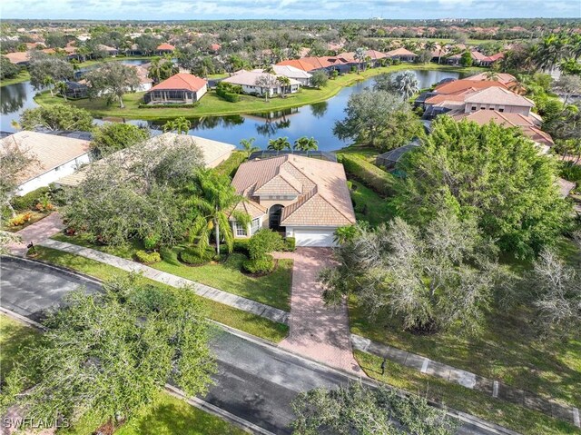 birds eye view of property featuring a water view