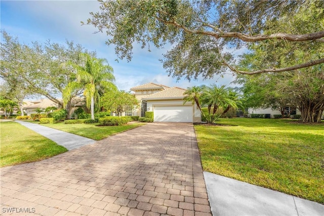 view of front of home with a garage and a front yard