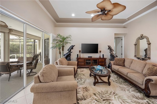 tiled living room featuring crown molding and ceiling fan