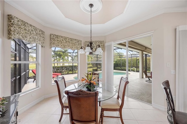 sunroom / solarium featuring a chandelier