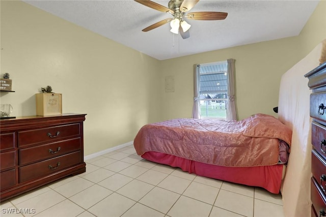 tiled bedroom with ceiling fan