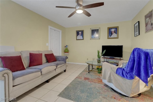 living room with ceiling fan and light tile patterned floors