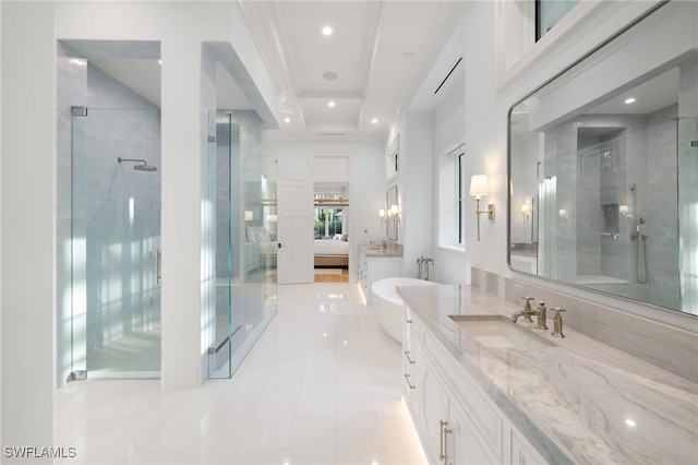 bathroom with vanity and independent shower and bath