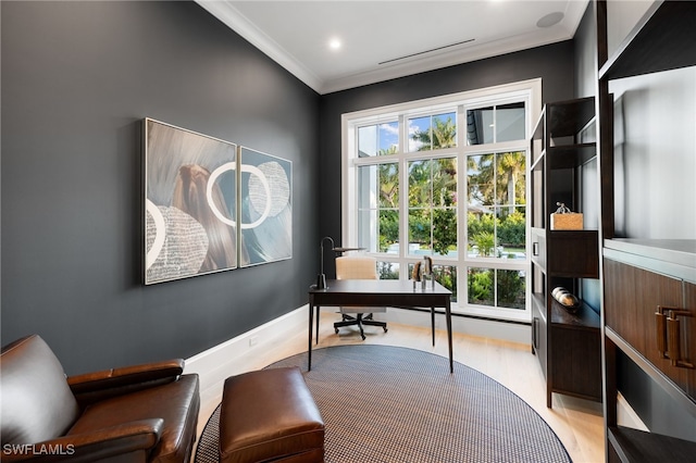 office space with crown molding and light hardwood / wood-style floors