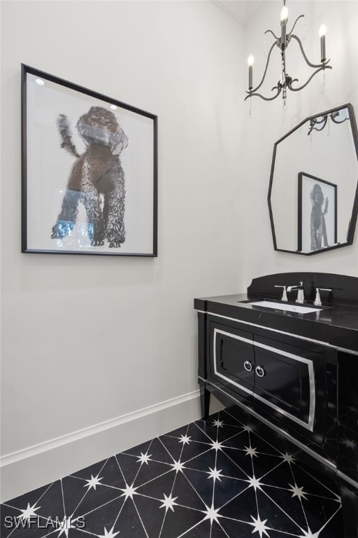 interior details with vanity and a chandelier