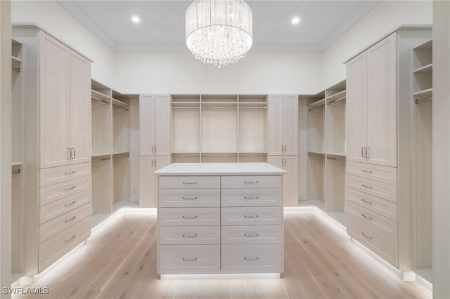 460 2nd Ave N, Naples, FL 34102 - walk in closet with light wood-style floors and a chandelier