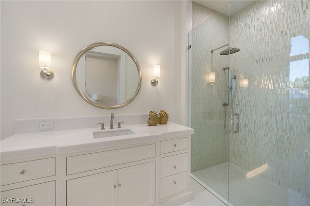 bathroom featuring vanity and an enclosed shower