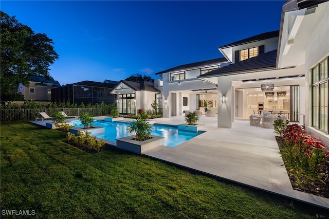 view of pool featuring a patio area and a lawn