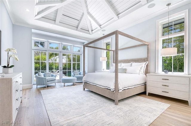 460 2nd Ave N, Naples, FL 34102 - bedroom featuring french doors, light wood-type flooring, crown molding, baseboards, and beam ceiling