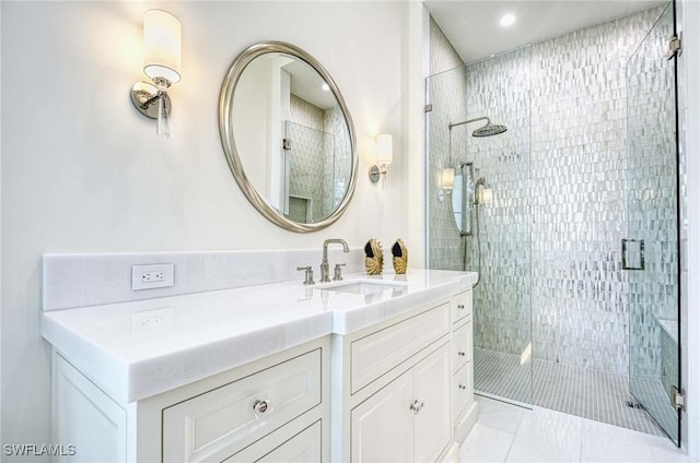 460 2nd Ave N, Naples, FL 34102 - bathroom featuring a stall shower, vanity, recessed lighting, and tile patterned flooring