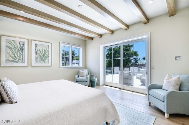 460 2nd Ave N, Naples, FL 34102 - bedroom featuring beamed ceiling, access to exterior, and light wood-style flooring