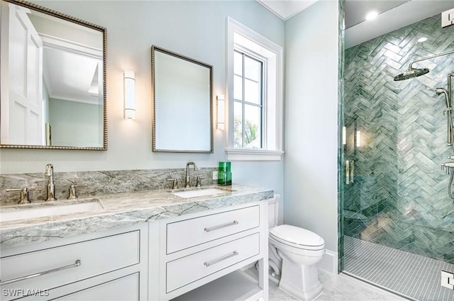 460 2nd Ave N, Naples, FL 34102 - bathroom with toilet, a shower stall, double vanity, and marble look tile flooring
