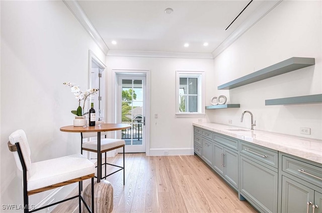 460 2nd Ave N, Naples, FL 34102 - kitchen featuring open shelves, a sink, gray cabinetry, crown molding, and light stone counters