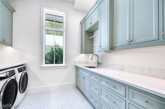 460 2nd Ave N, Naples, FL 34102 - clothes washing area with cabinet space, washing machine and clothes dryer, light flooring, and baseboards