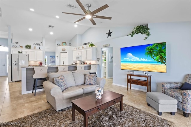 living room featuring high vaulted ceiling, light tile patterned floors, and ceiling fan