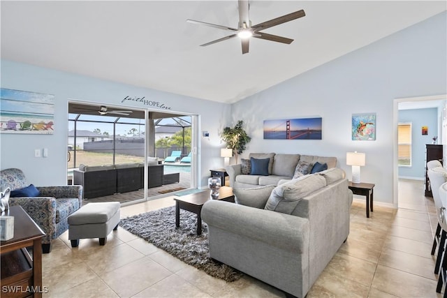 tiled living room with ceiling fan and vaulted ceiling