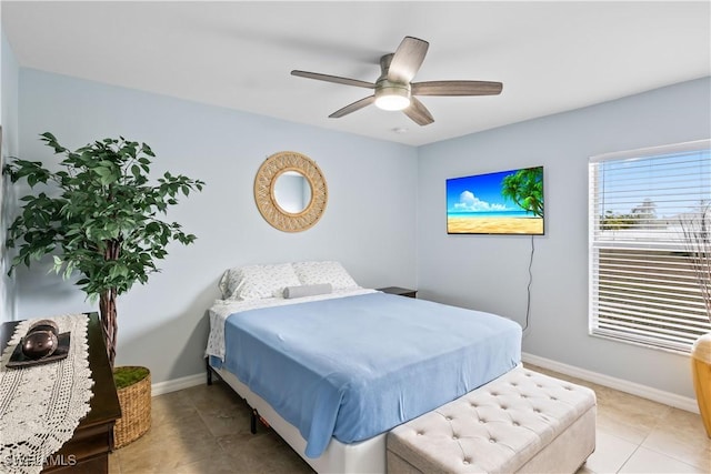 bedroom with light tile patterned flooring and ceiling fan