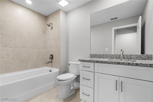 337 Woodburn Dr, Lehigh Acres, FL 33972 - full bathroom with toilet, washtub / shower combination, vanity, tile patterned flooring, and baseboards