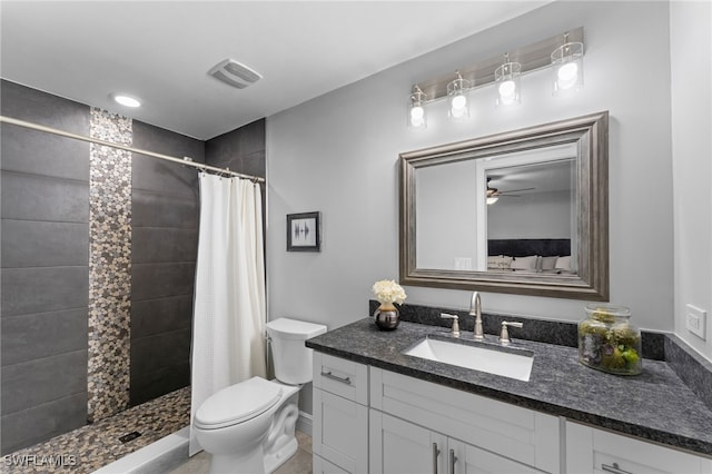 bathroom with tile patterned flooring, toilet, vanity, and a shower with shower curtain