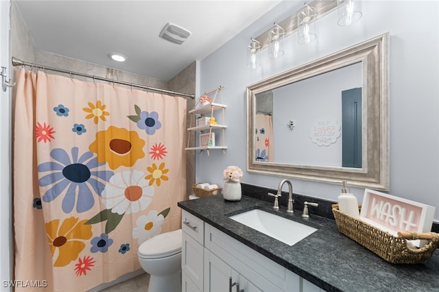 bathroom featuring curtained shower, toilet, and vanity