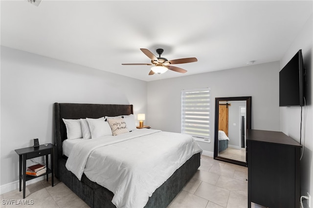 tiled bedroom featuring ceiling fan