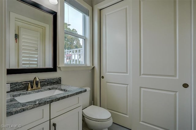 bathroom with vanity and toilet