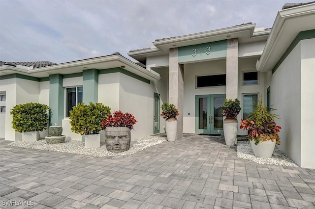 doorway to property featuring french doors