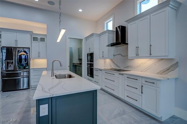 kitchen featuring decorative light fixtures, tasteful backsplash, sink, black appliances, and wall chimney exhaust hood