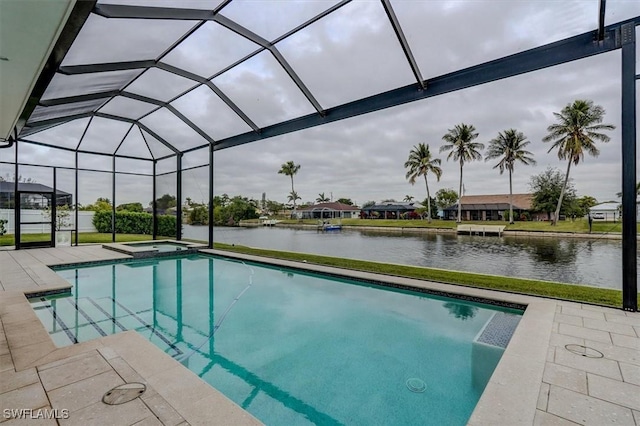 view of pool featuring a water view, an in ground hot tub, a patio area, and glass enclosure