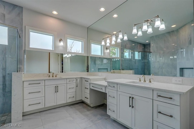 bathroom featuring walk in shower and vanity