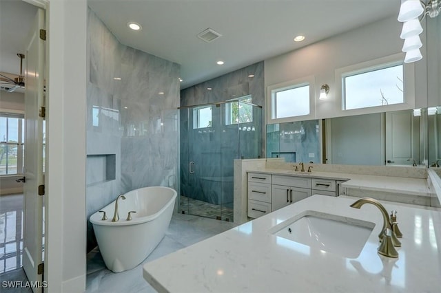 bathroom with vanity and plus walk in shower