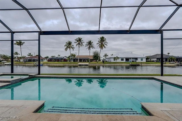 view of pool featuring a water view and glass enclosure