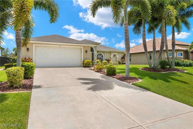 view of front facade with a front yard and a garage