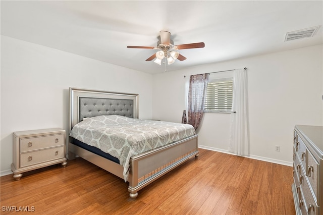 bedroom featuring ceiling fan and light hardwood / wood-style flooring