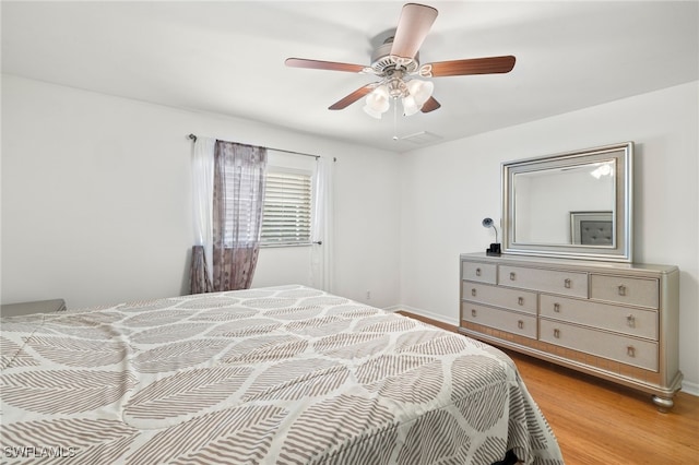 bedroom featuring ceiling fan and light hardwood / wood-style floors