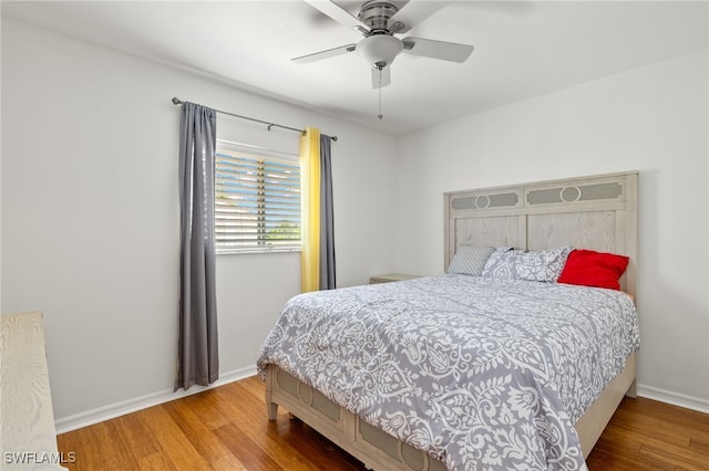 bedroom featuring ceiling fan and hardwood / wood-style floors