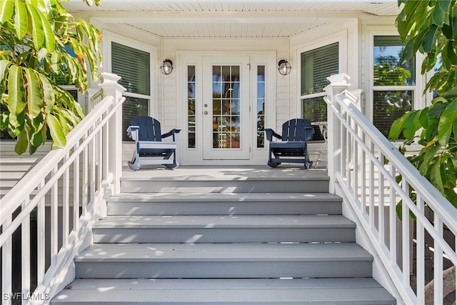 property entrance with covered porch